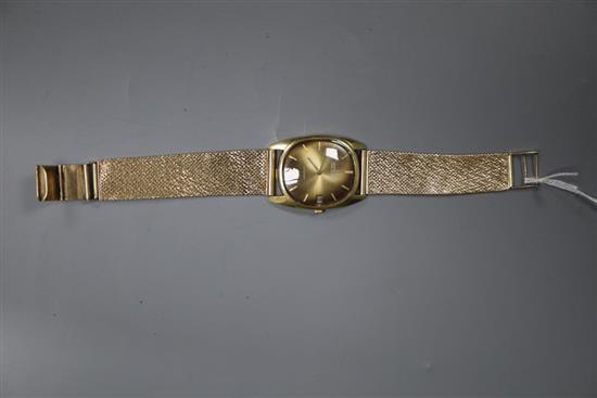 A gentlemans 18ct gold Universal Geneve Golden Shadow Date automatic wristwatch, on 9ct gold mesh bracelet,